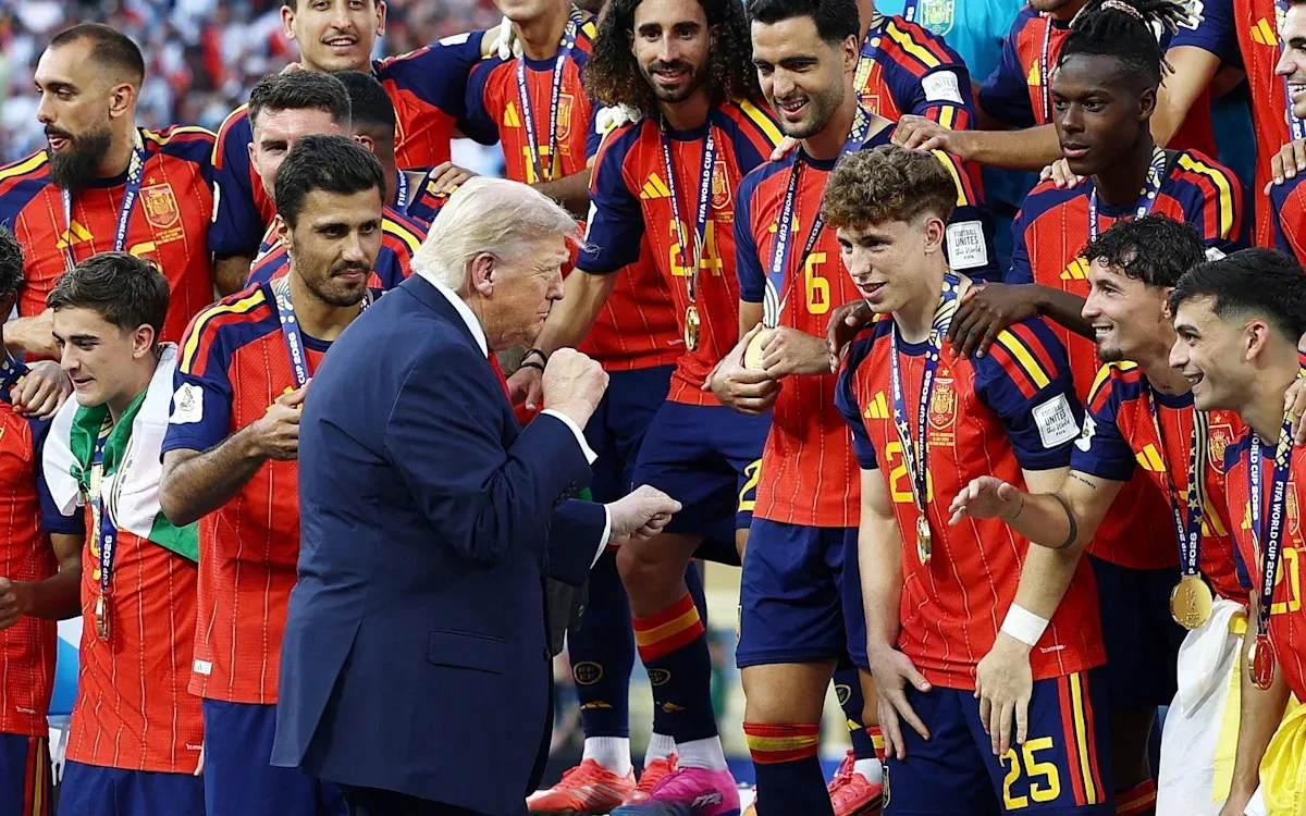 Donald Trump refuses to leave stage during World Cup trophy lift