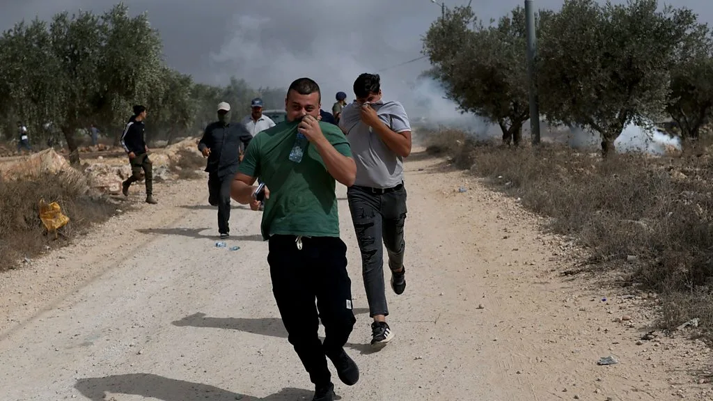 Israeli settlers attack Palestinians and journalist in West Bank harvest